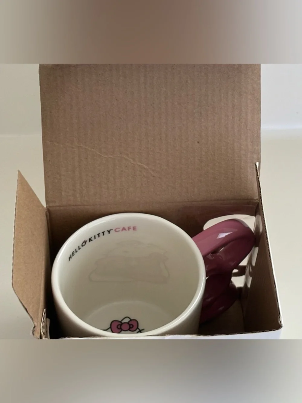 NIB Hello Kitty Cafe White Mug Pink Handle Gray Graphics Logo Box Artwork 12 oz